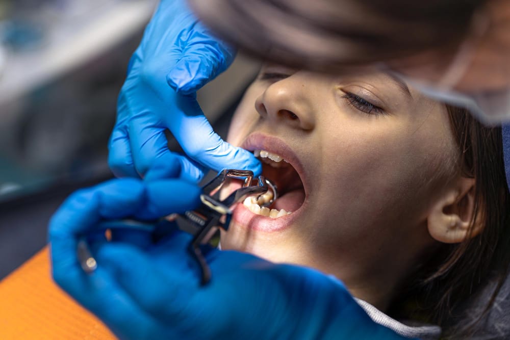 Close work on a young patient’s teeth during treatment